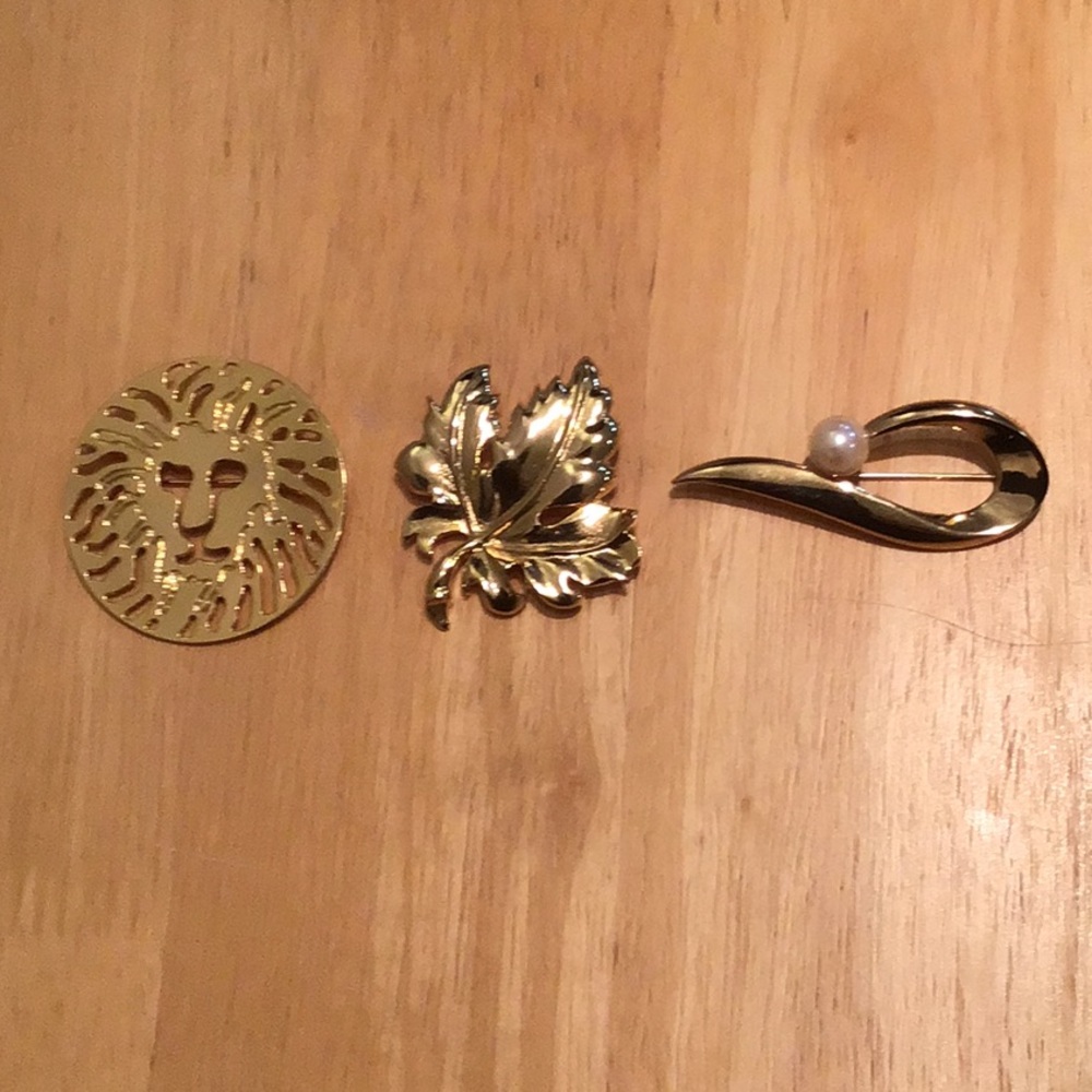 Three vintage (80s/90s) gold-toned brooches-- leaf, teardrop,and Anne Klein lion